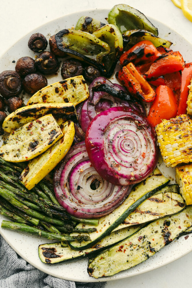 Variety of grilled vegetables on serving dish.