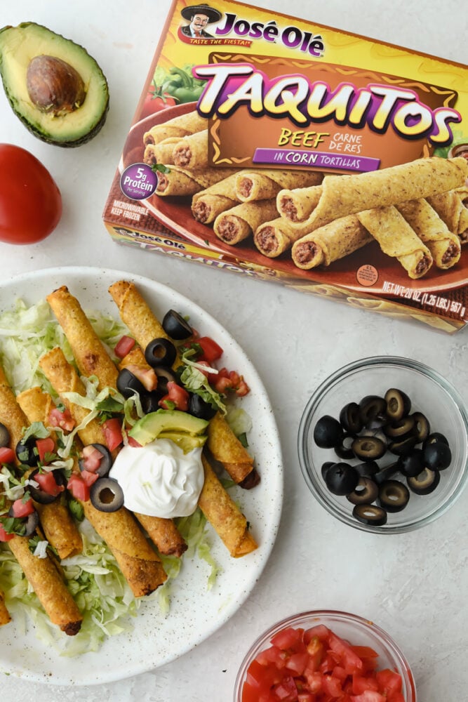 Jose Ole taquitos on a white plate with the Jose Ole taquitos box next to it. 