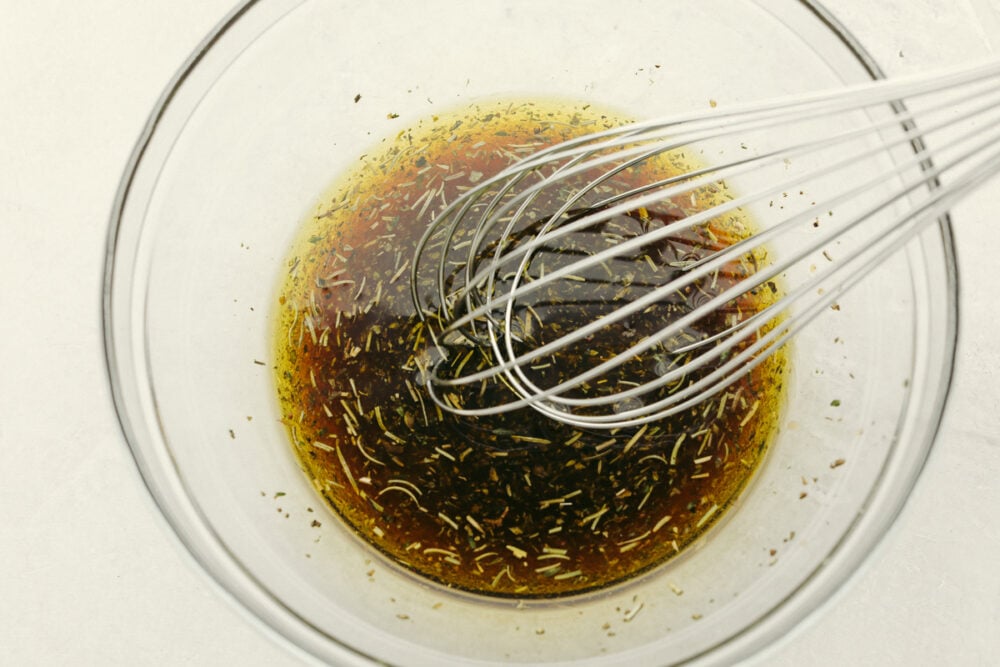 Whisking marinade ingredients together.