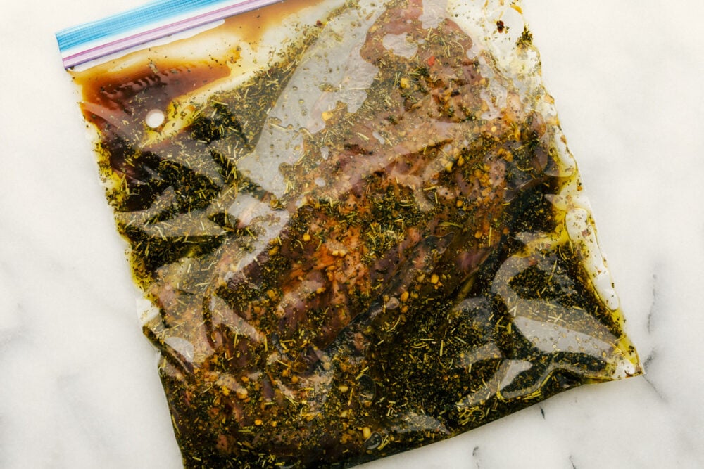 A ziplock bag of skirt steak marinade. 