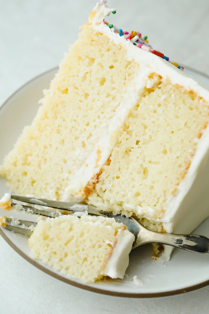Taking a bite of The Absolute Best White Cake.