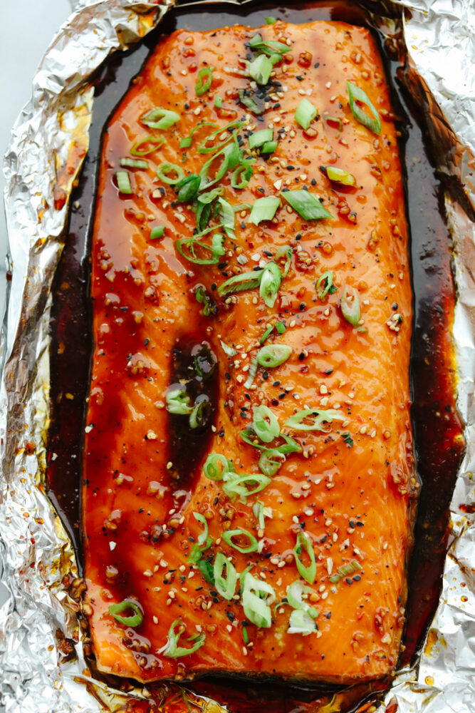 Salmon in tin foil covered with glaze.