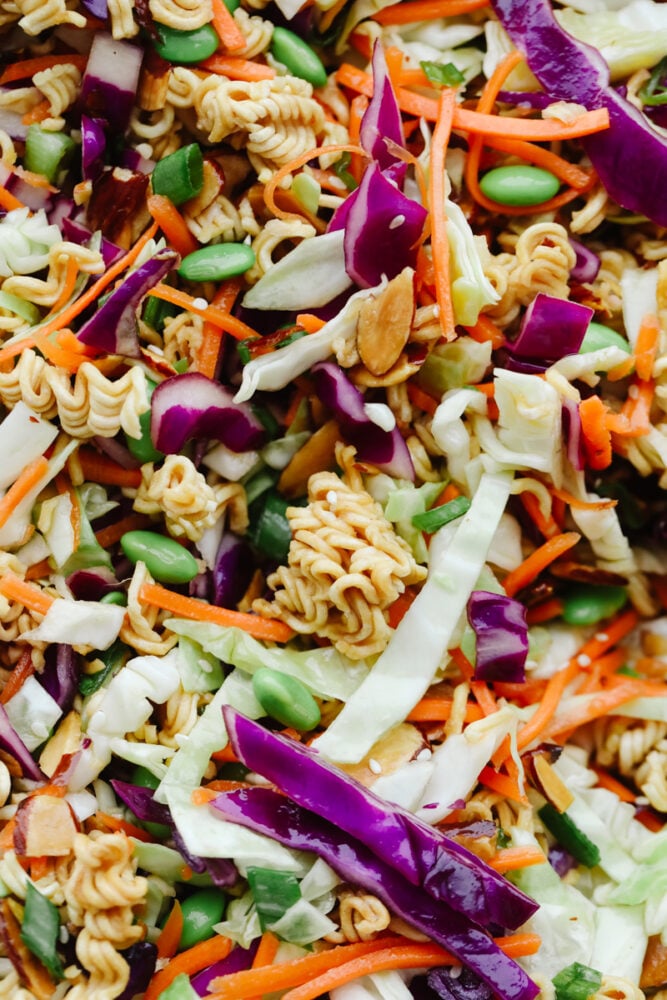 Asian Ramen Salad is full of color, flavor, and crunch! All of the fun textures make it perfectly satisfying and insanely delicious! Close up of the Asian Ramen Salad to show color and texture.