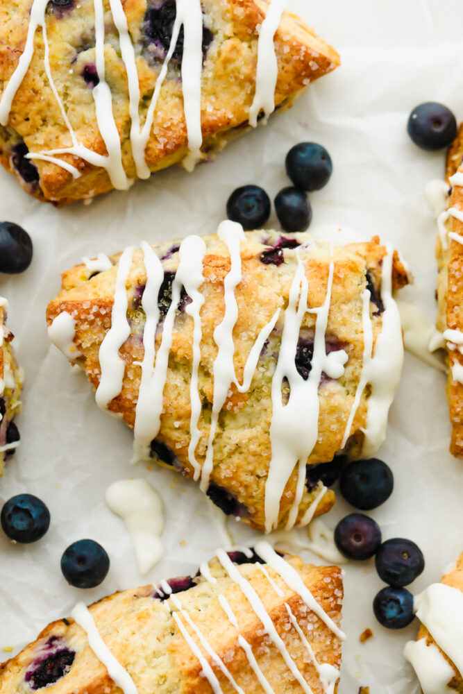 Blueberry Scones with icing drizzled on top.