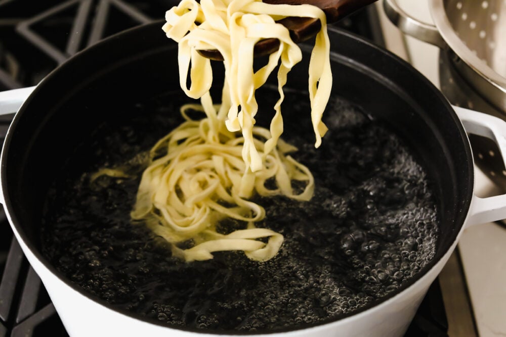 Cooking pasta in a pot of boiling water. 