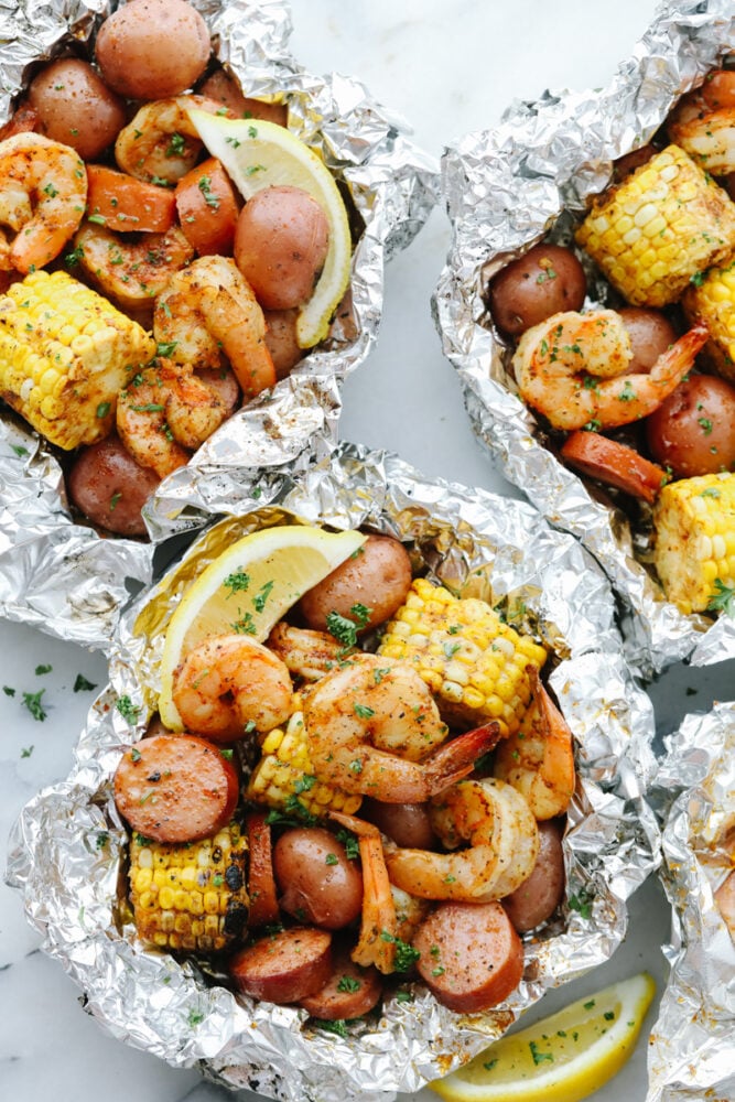 Shrimp Boil Foil Packets with lemon garnish.