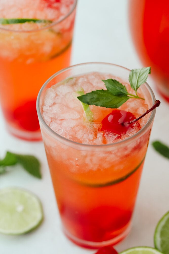 Close-up of a cherry limeade with mint garnish.