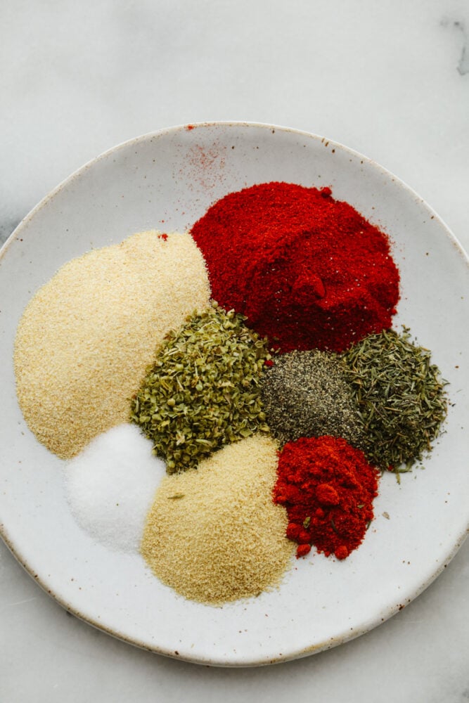 Spices ready to be mixed together in a bowl. 