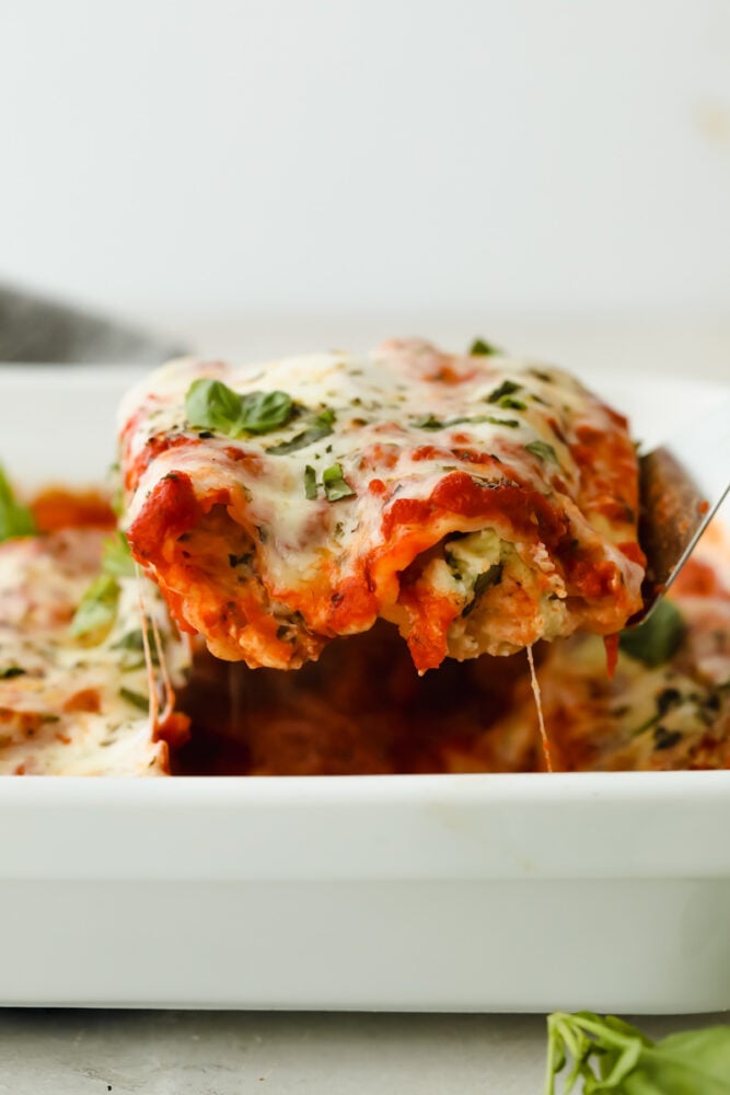 Close up of manicotti being served.