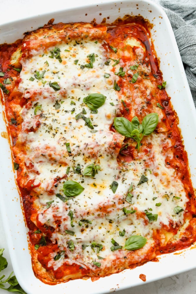 Cooked manicotti in a casserole dish. 