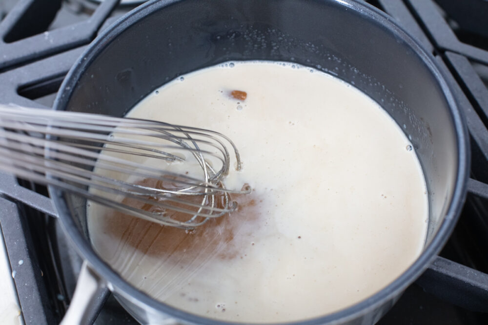 Ingredients being whisked on the stove. 