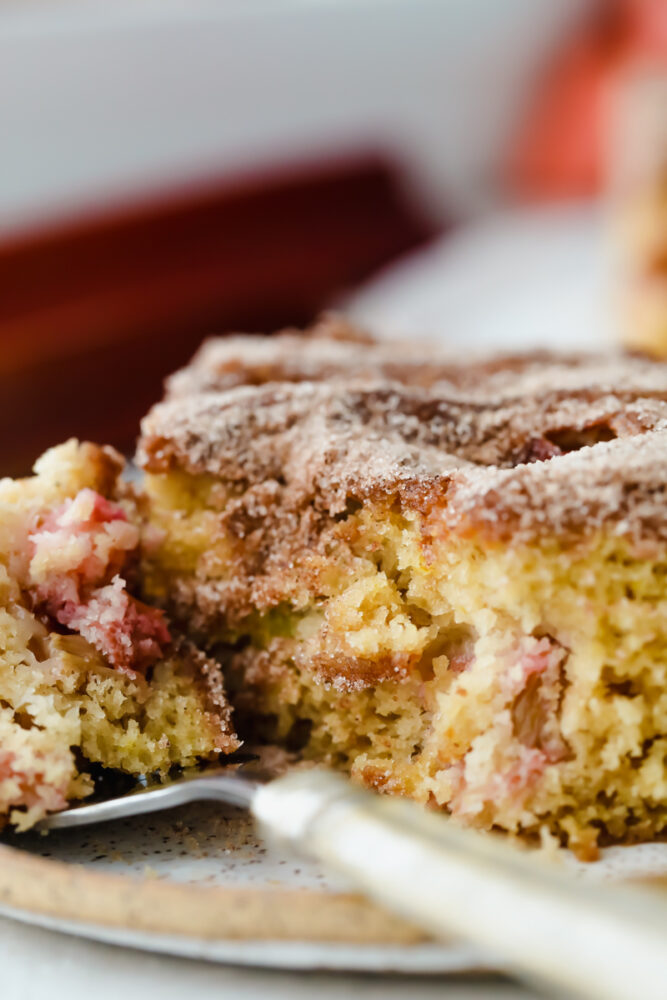 Cinnamon sugar rhubarb cake being served on a fork. 