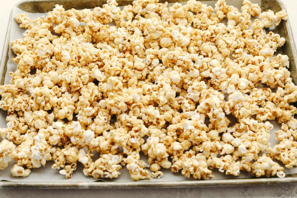 Caramel corn on a cookie sheet. 