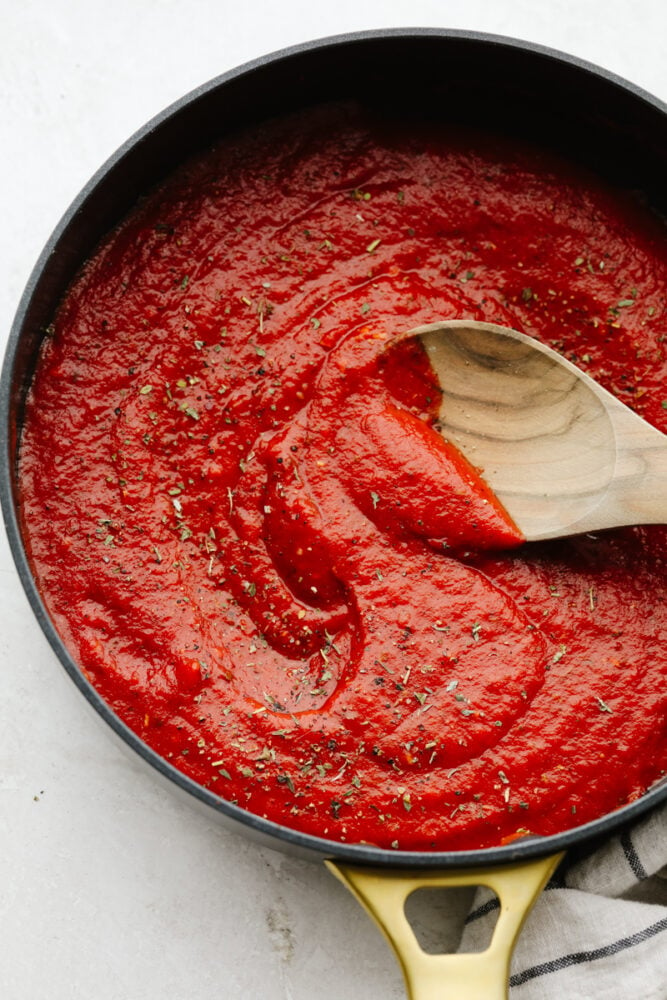 Finished pizza sauce in a saucepan.
