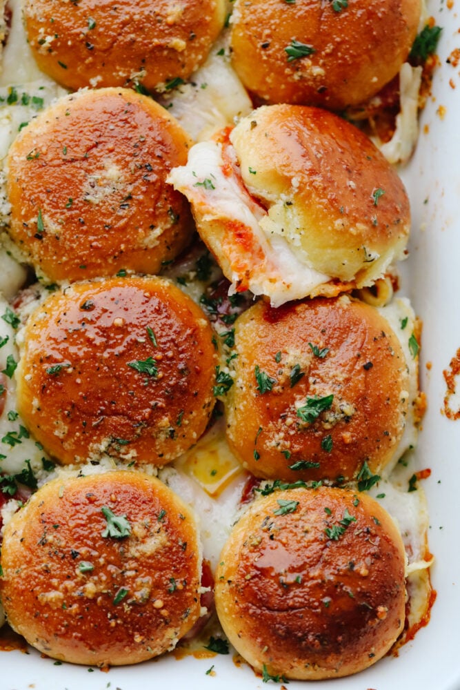 A top-down view of 8 pizza sliders.