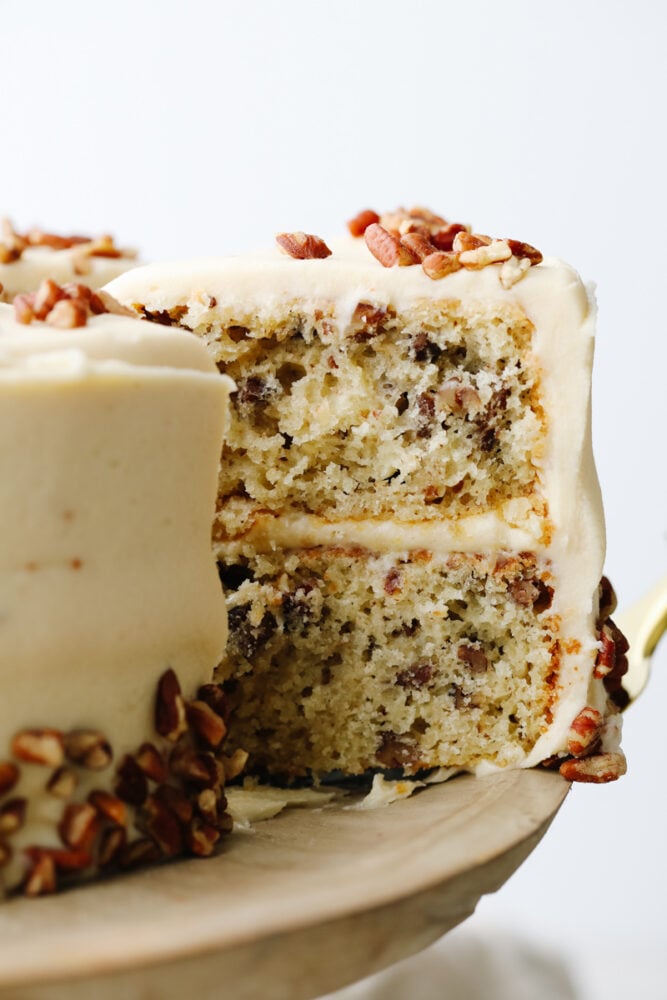 Taking a slice of butter pecan cake.