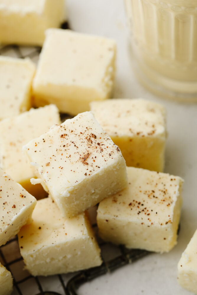 Closeup of eggnog fudge cubes dusted with nutmeg.