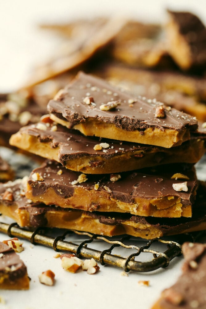 A closeup stack of 4 pieces of toffee.
