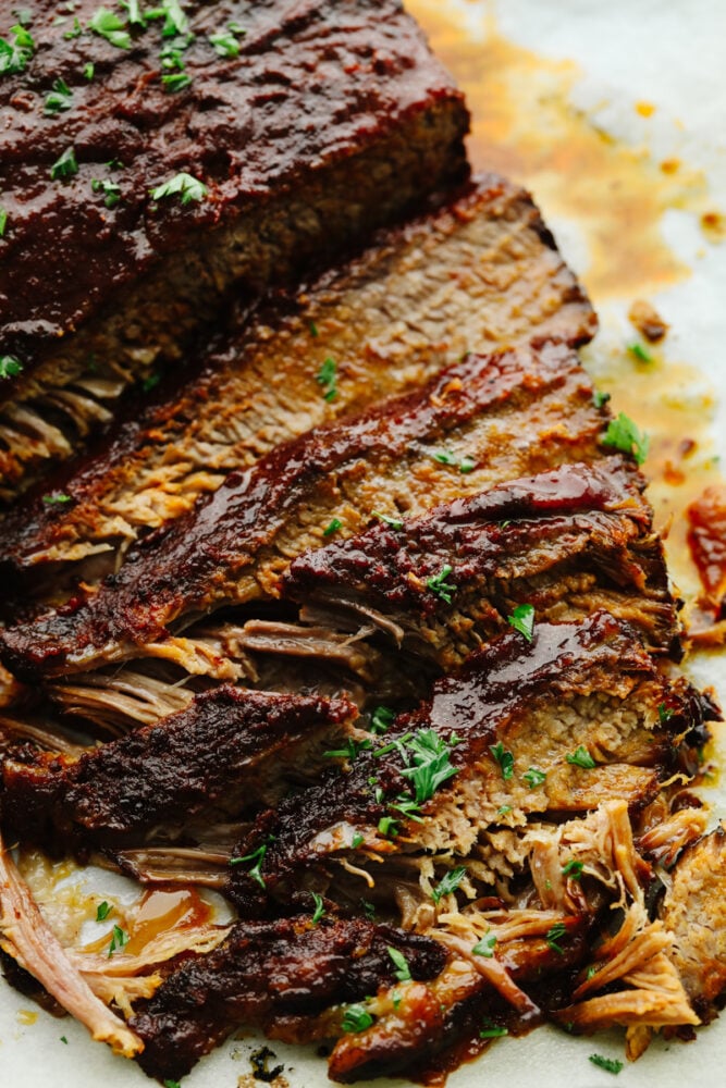 A zoomed in picture of a sliced slow cooker beef brisket. 