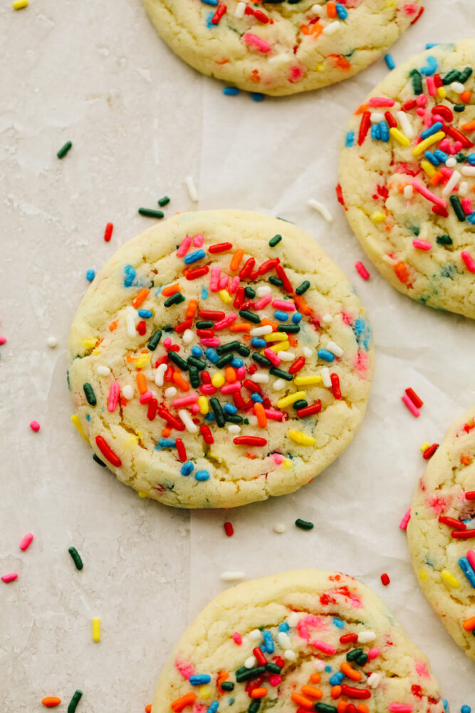 Sprinkle cookies on parchment paper. 
