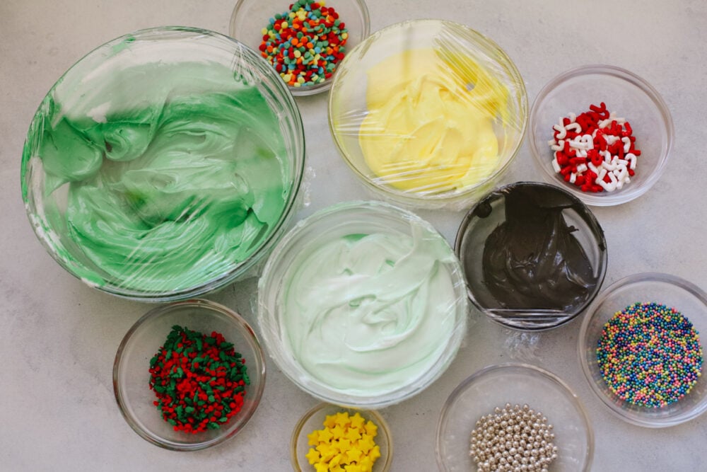 Various frosting colors and sprinkles.