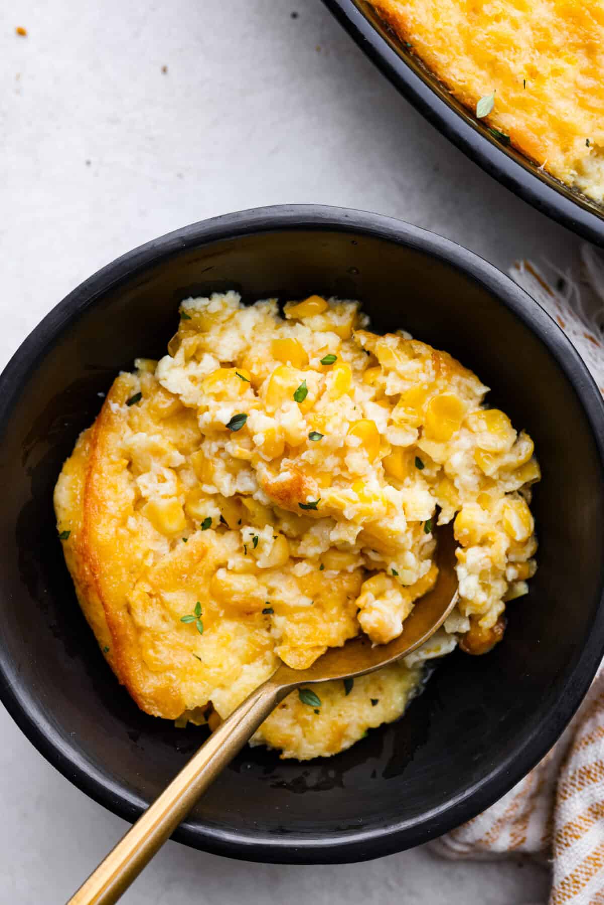 Overhead shot of a bowl of corn pudding. 