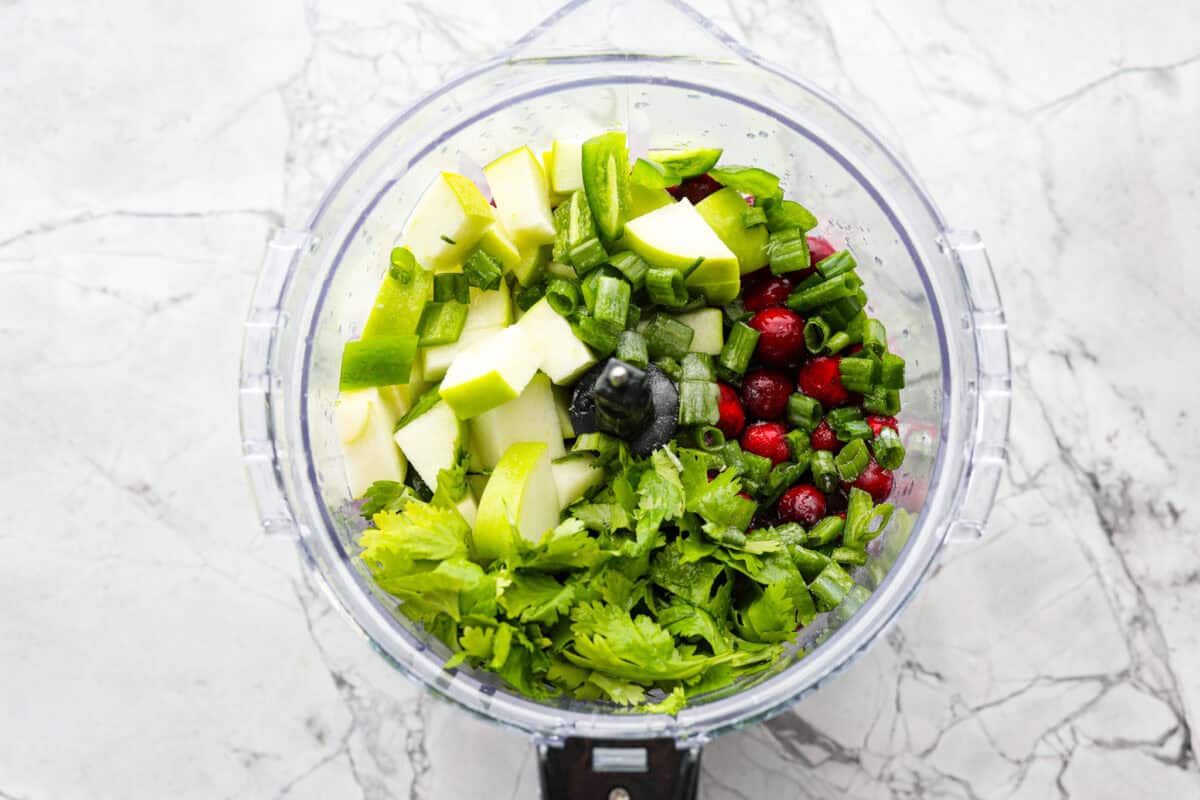 Overhead shot of ingredients in a food processor. 