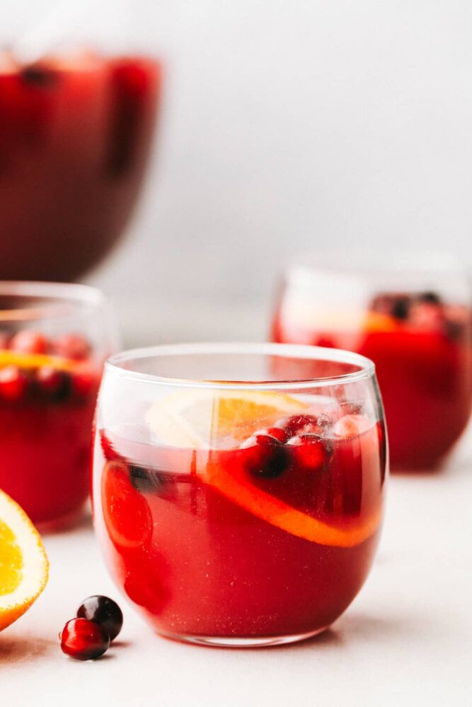 A glass filled with Christmas punch. 