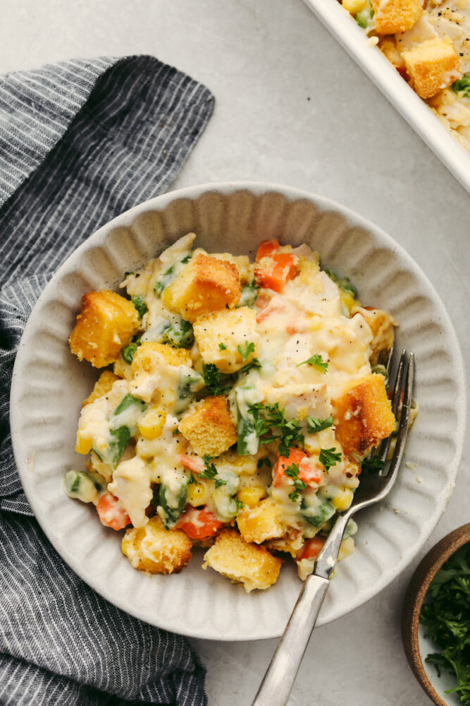 Turkey casserole in a bowl with a fork on the side. 