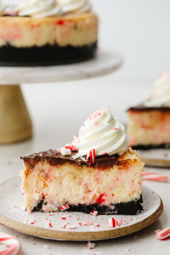 A slice of peppermint cheesecake on a plate. 
