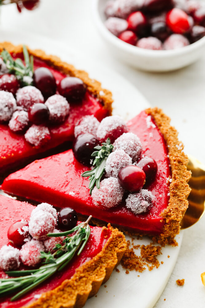 Taking a slice of cranberry curd tart.