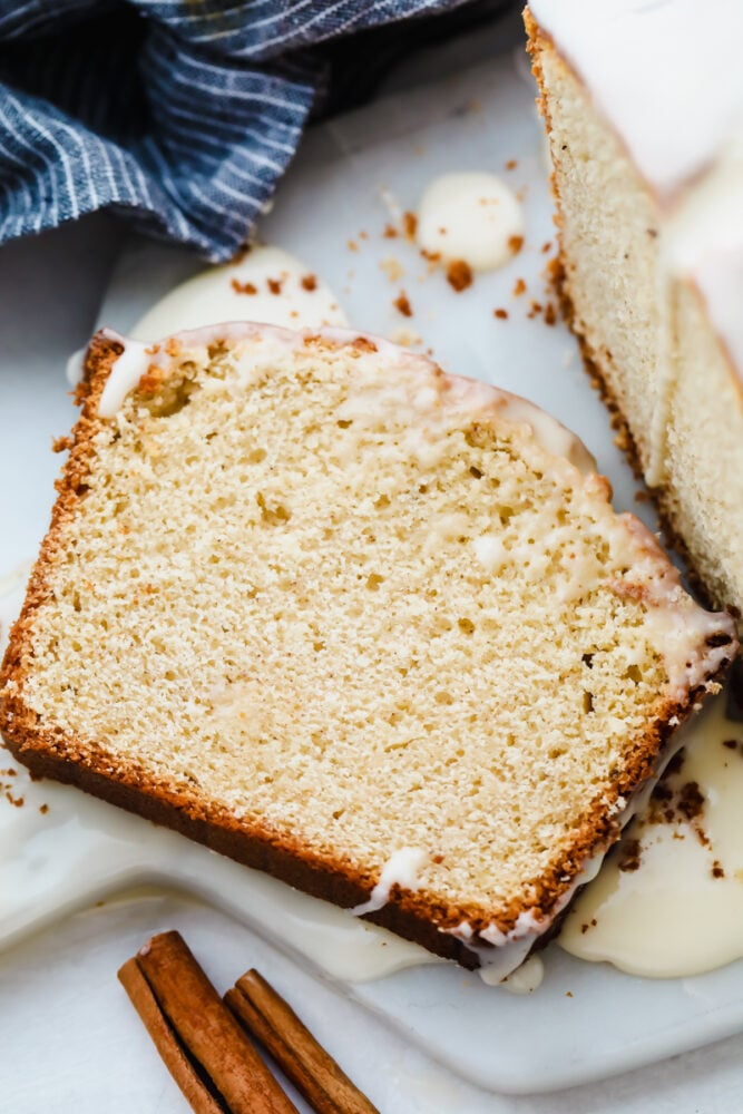 A slice of eggnog quick bread on a plate. 