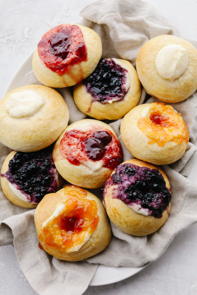 Different flavored kolaches on a platter. 