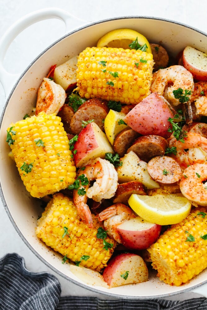 Shrimp boil ingredients in a pot. 