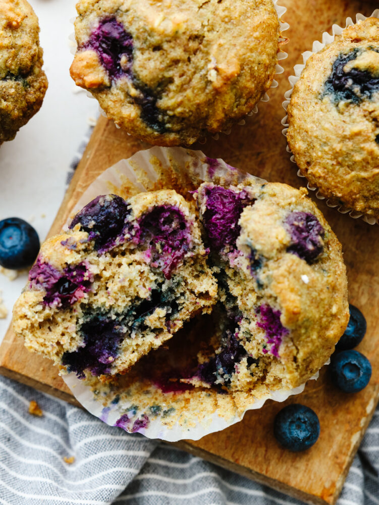 A blueberry oatmeal muffin torn in half.