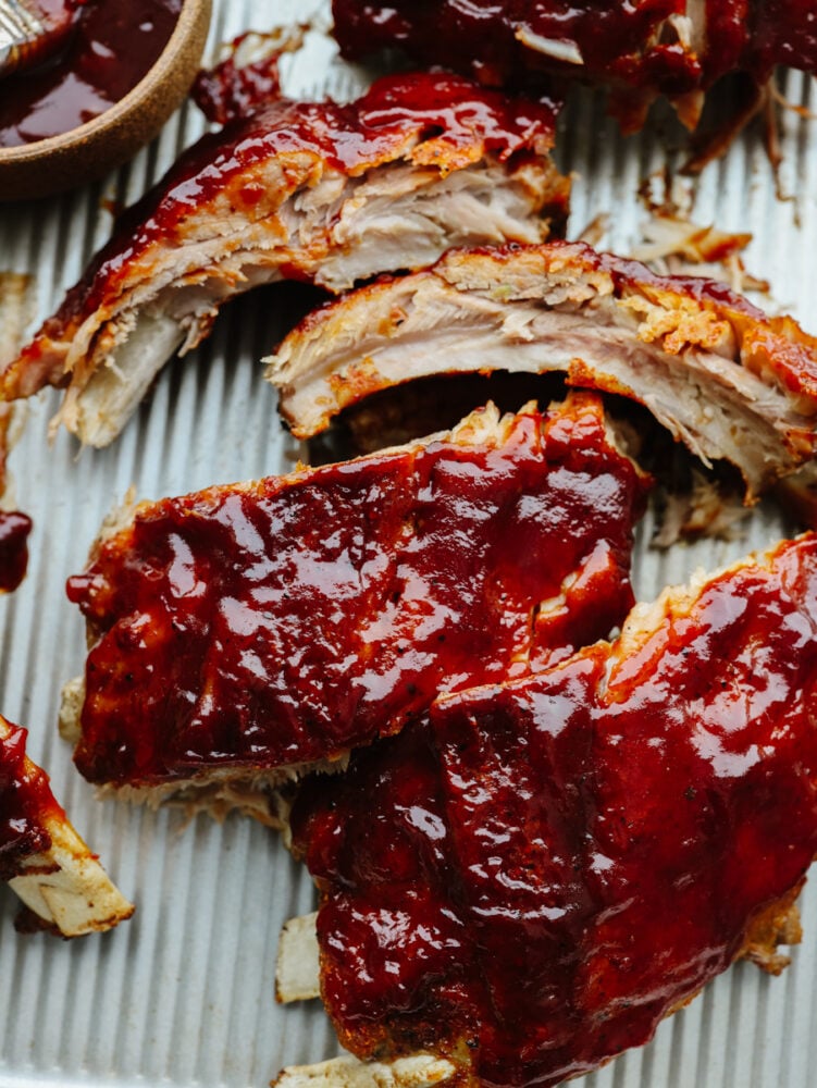 A close up of ribs with BBQ sauce on them. 
