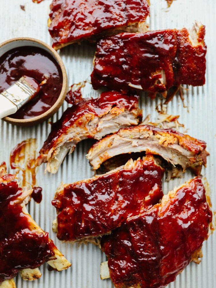 Pieces of ribs with BBQ sauce on them. 