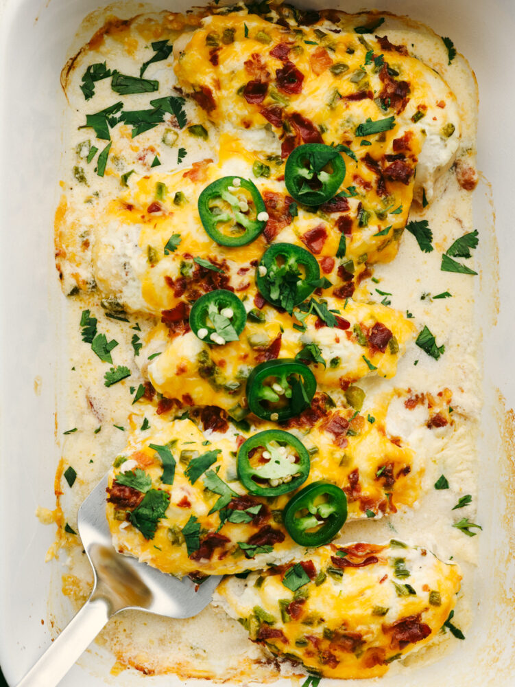 5 baked chicken breasts covered in cheese and jalapenos.