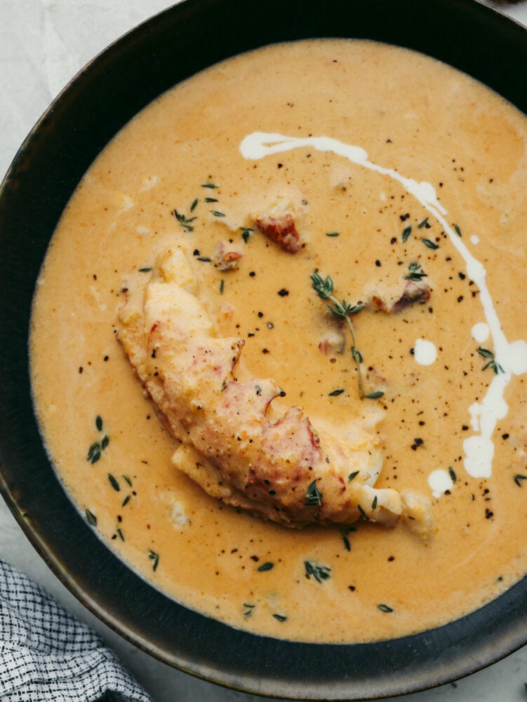 A close up of a bowl of lobster bisque. 