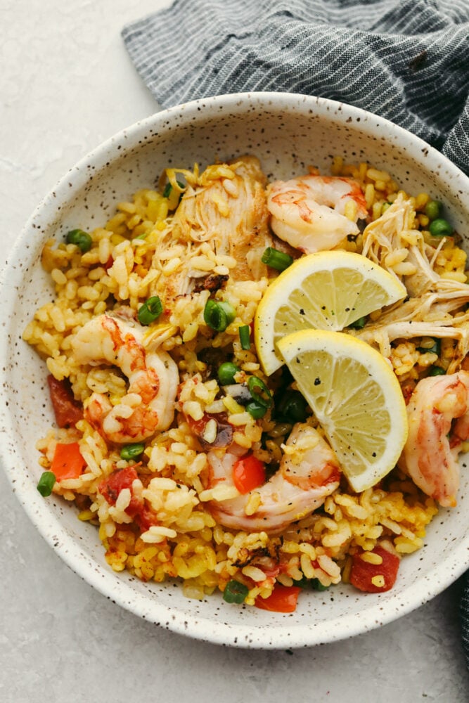 Chicken and shrimp paella in a bowl. 