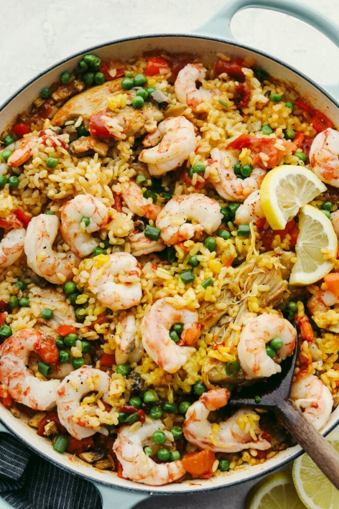 Chicken and shrimp paella in a skillet. 