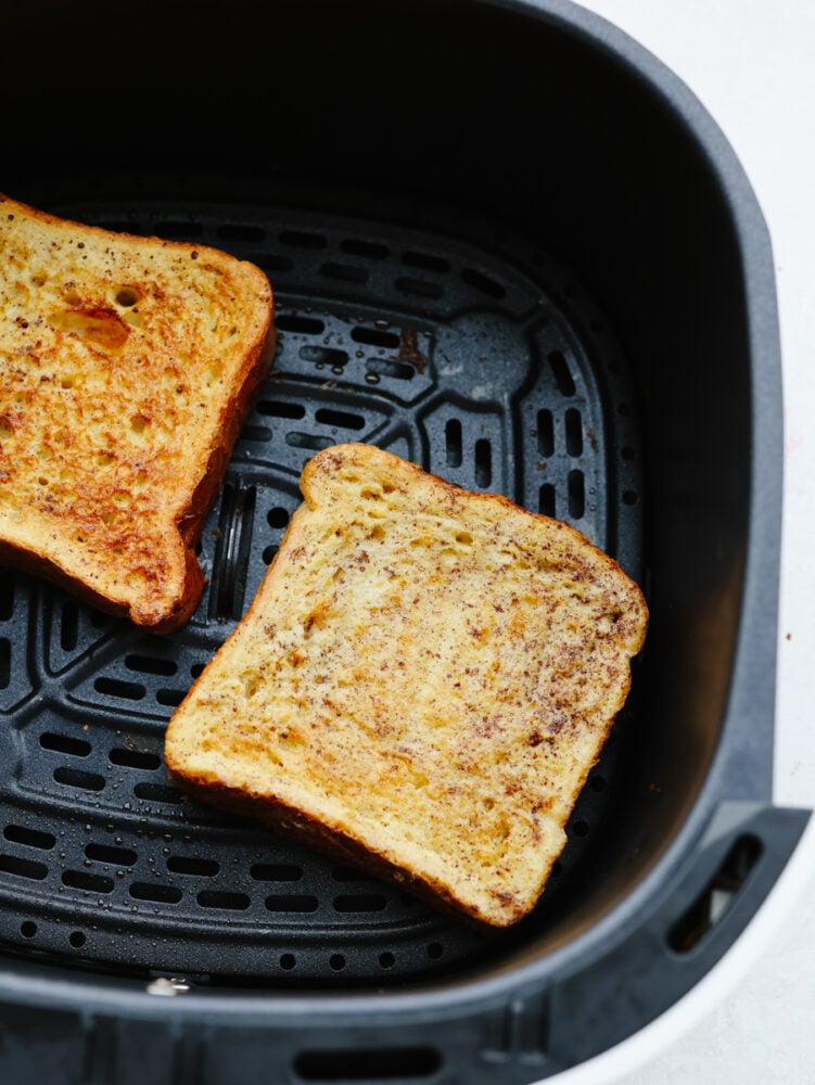 2 pieces of cooked french toast in the air fryer. 
