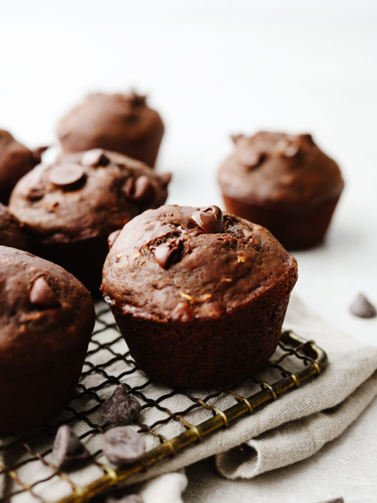 Double chocolate muffins on a cooling rack. 