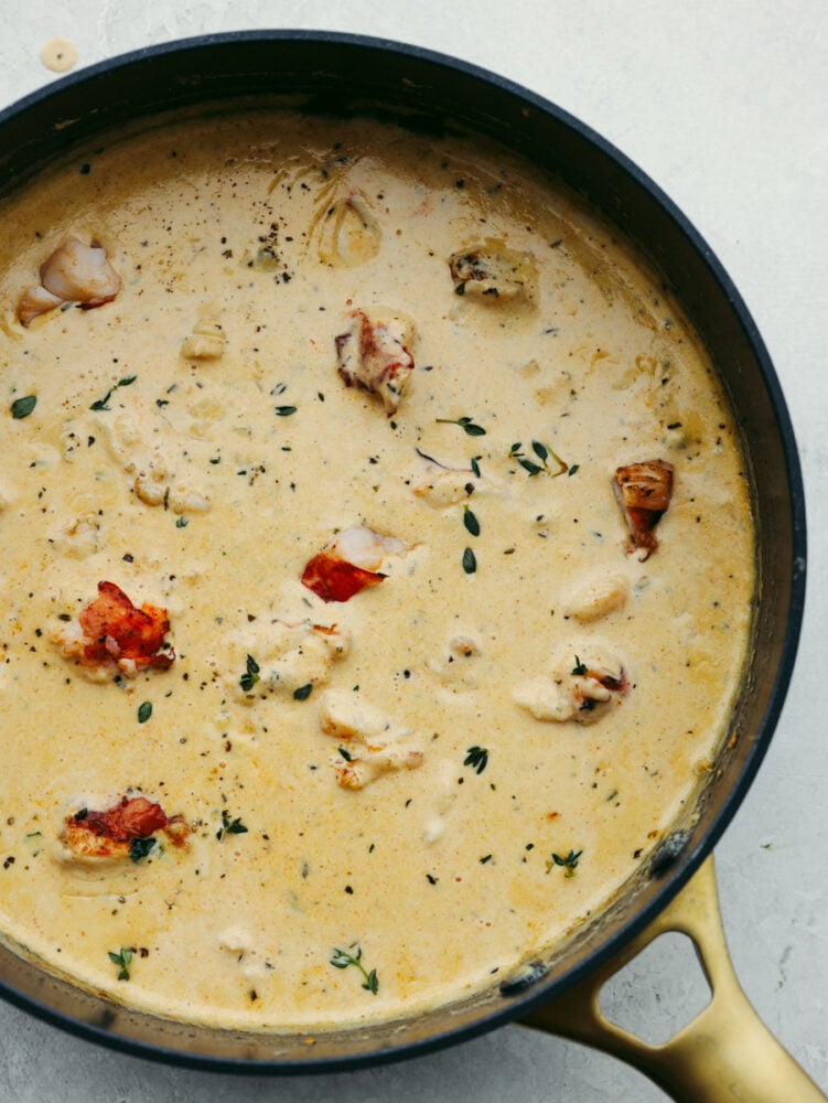 Lobster ravioli sauce in a saucepan.