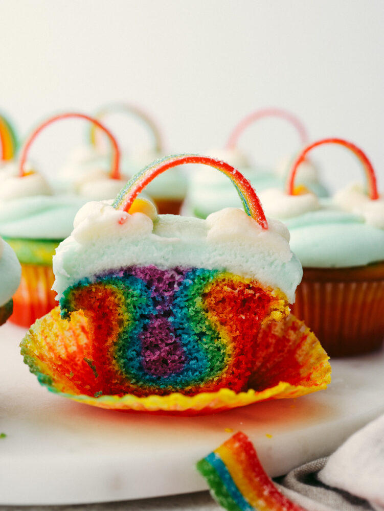 A rainbow cupcake cut in half.