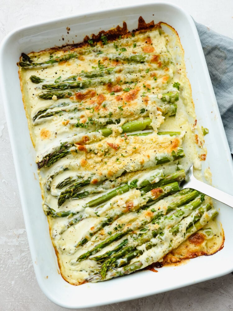 The top view of asparagus in a 9x13 baking dish, cooked ad ready to be served. 