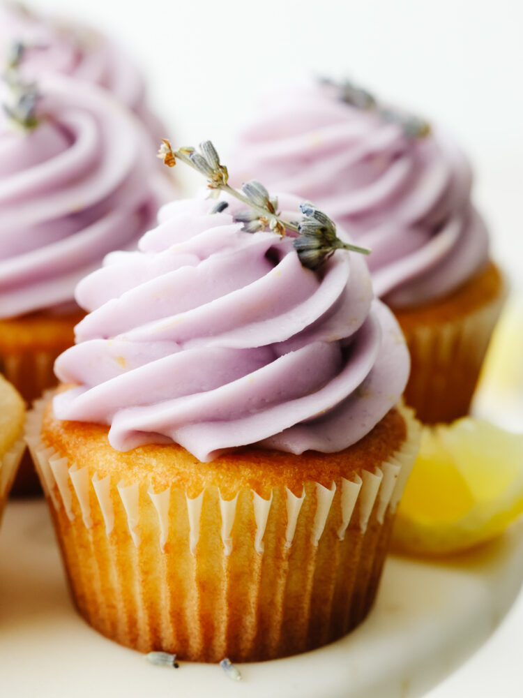 A close up of a lavender cupcake. 