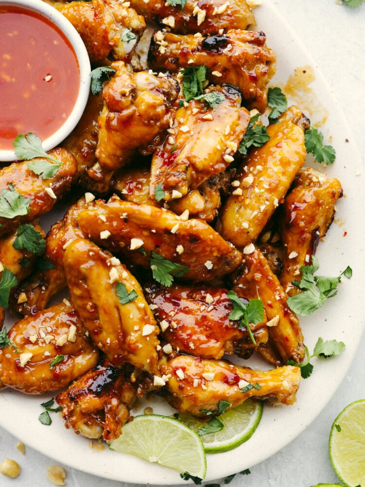 A plate of Thai glazed chicken wings garnished with cilantro.