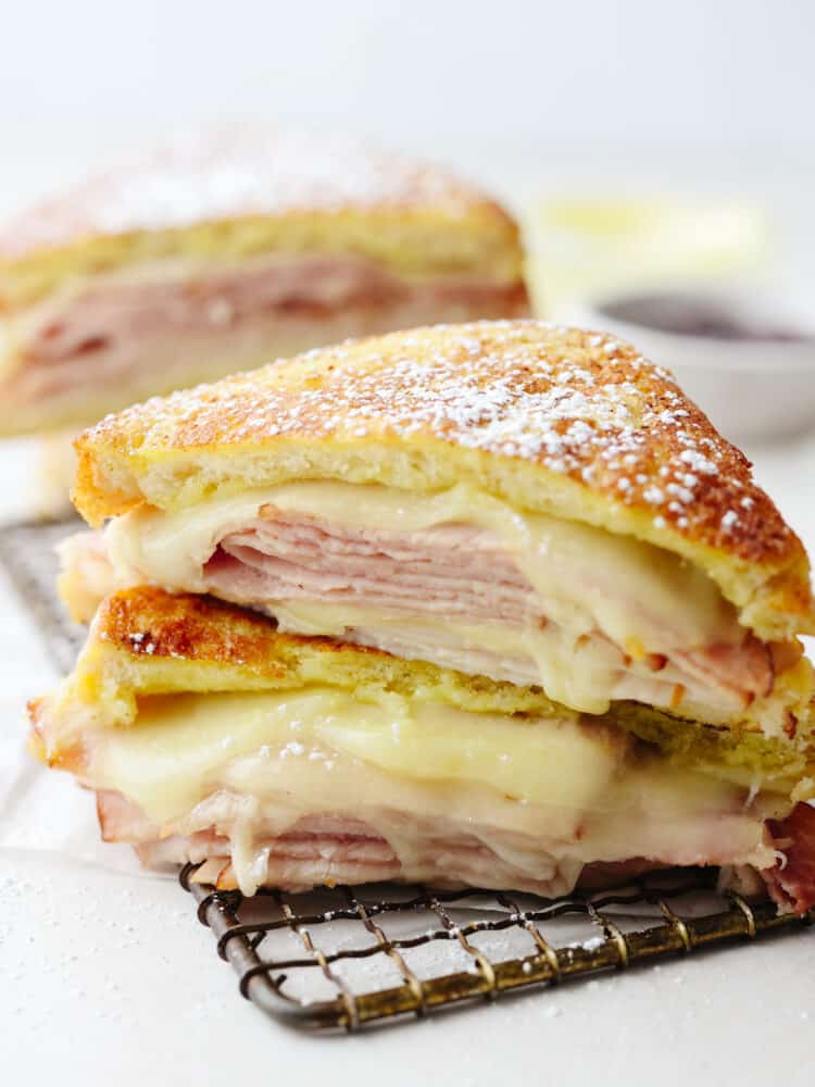 A monte cristo sandwich, ready to eat on a cooling rack. 