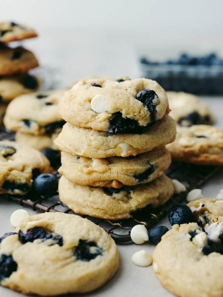4 blueberry cookies stacked on top of each other.